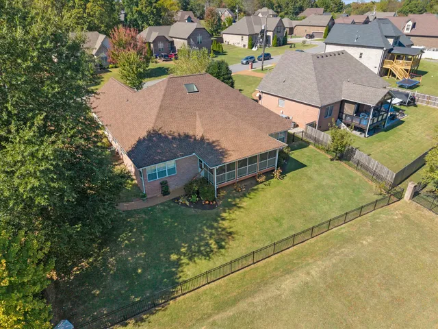 an aerial view of a house with a garden