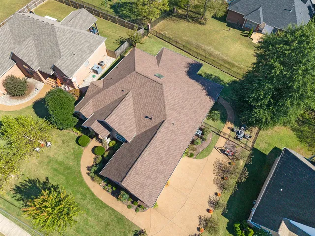 an aerial view of a house with a swimming pool