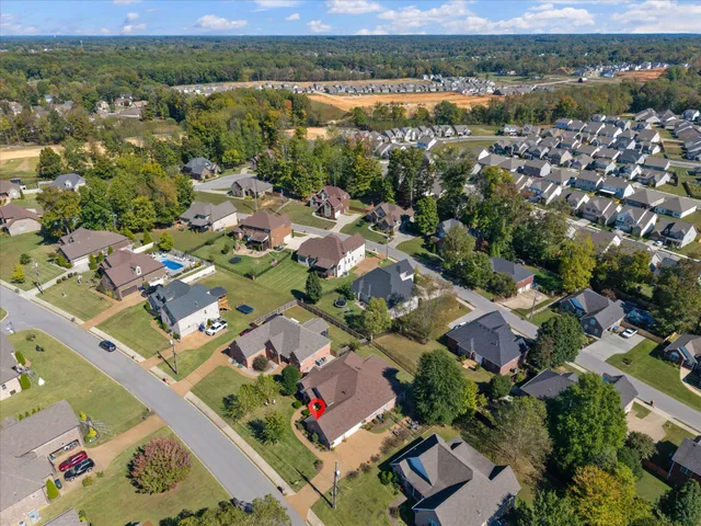 an aerial view of residential houses with outdoor space