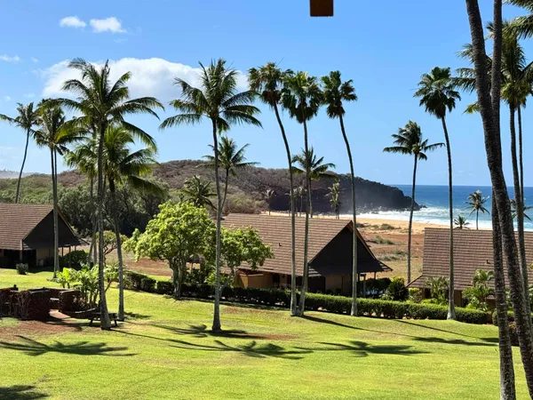 a view of a swimming pool with a table and chairs
