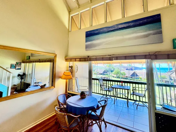 a view of a dining room with furniture window and outside view