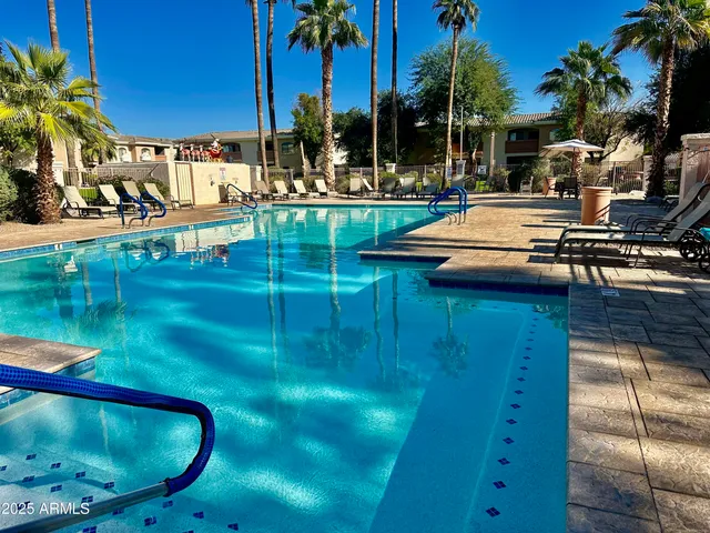 a view of swimming pool with a patio