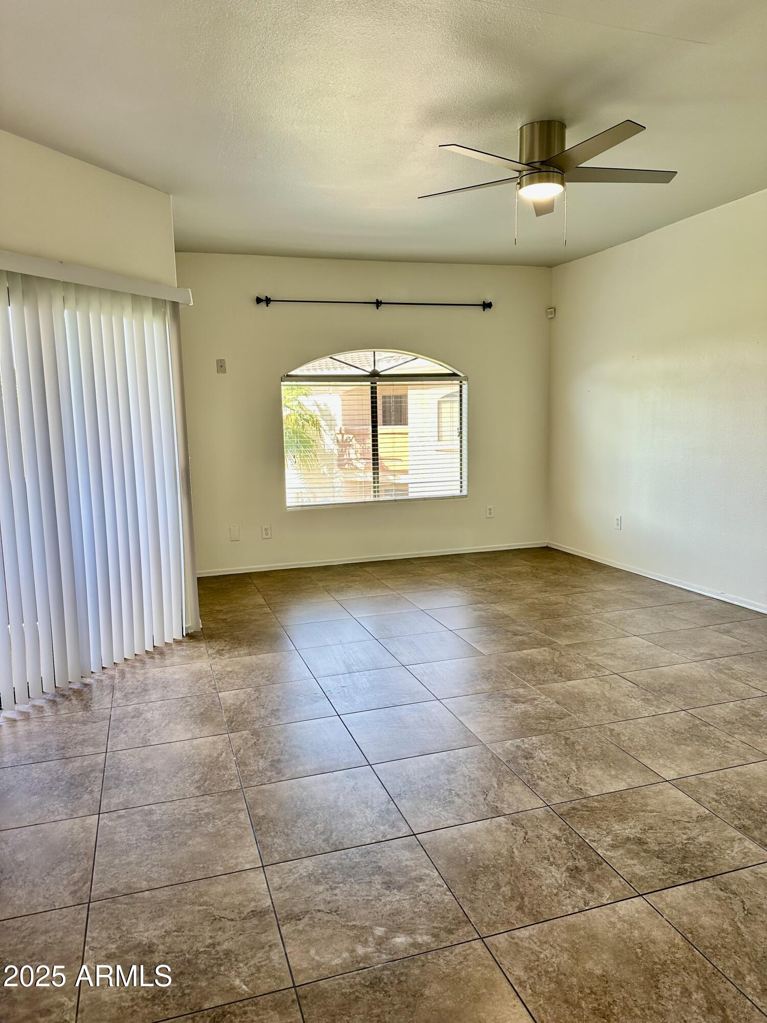 10030 West Indian School Road, Unit 227 Phoenix, AZ 85037 - Photo 11 of 22 a view of an empty room with a window
