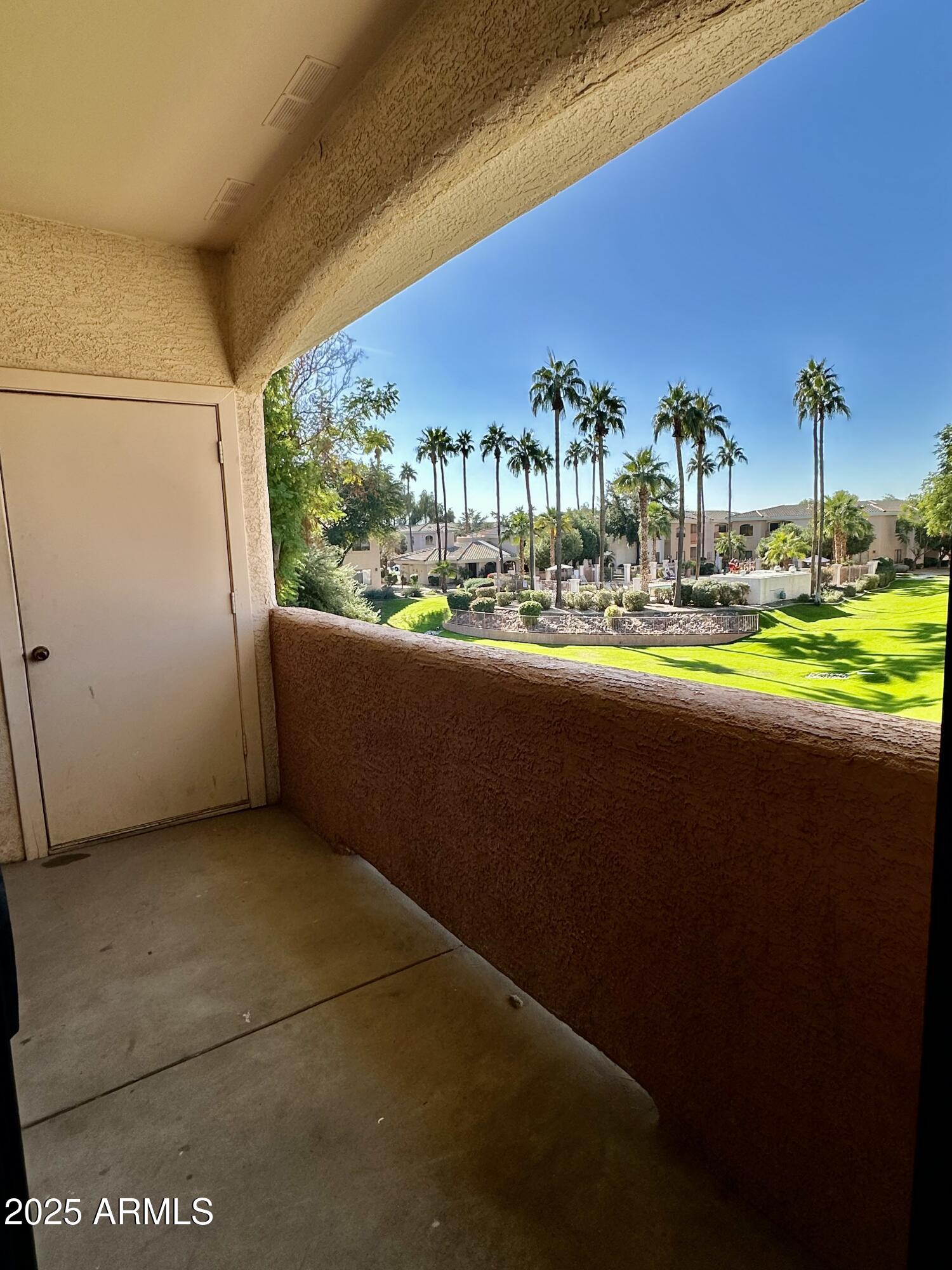 10030 West Indian School Road, Unit 227 Phoenix, AZ 85037 - Photo 16 of 22 a view of a building from a yard