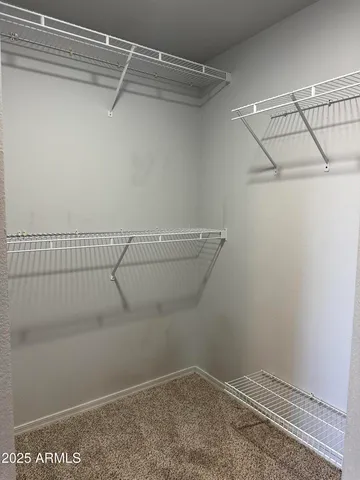 a view of a room with racks on the wall