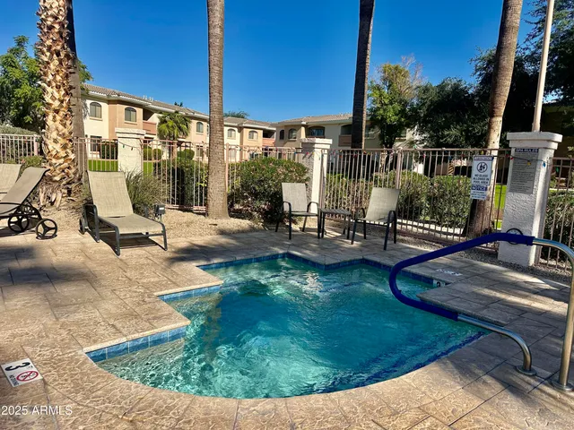 a view of a swimming pool with a patio