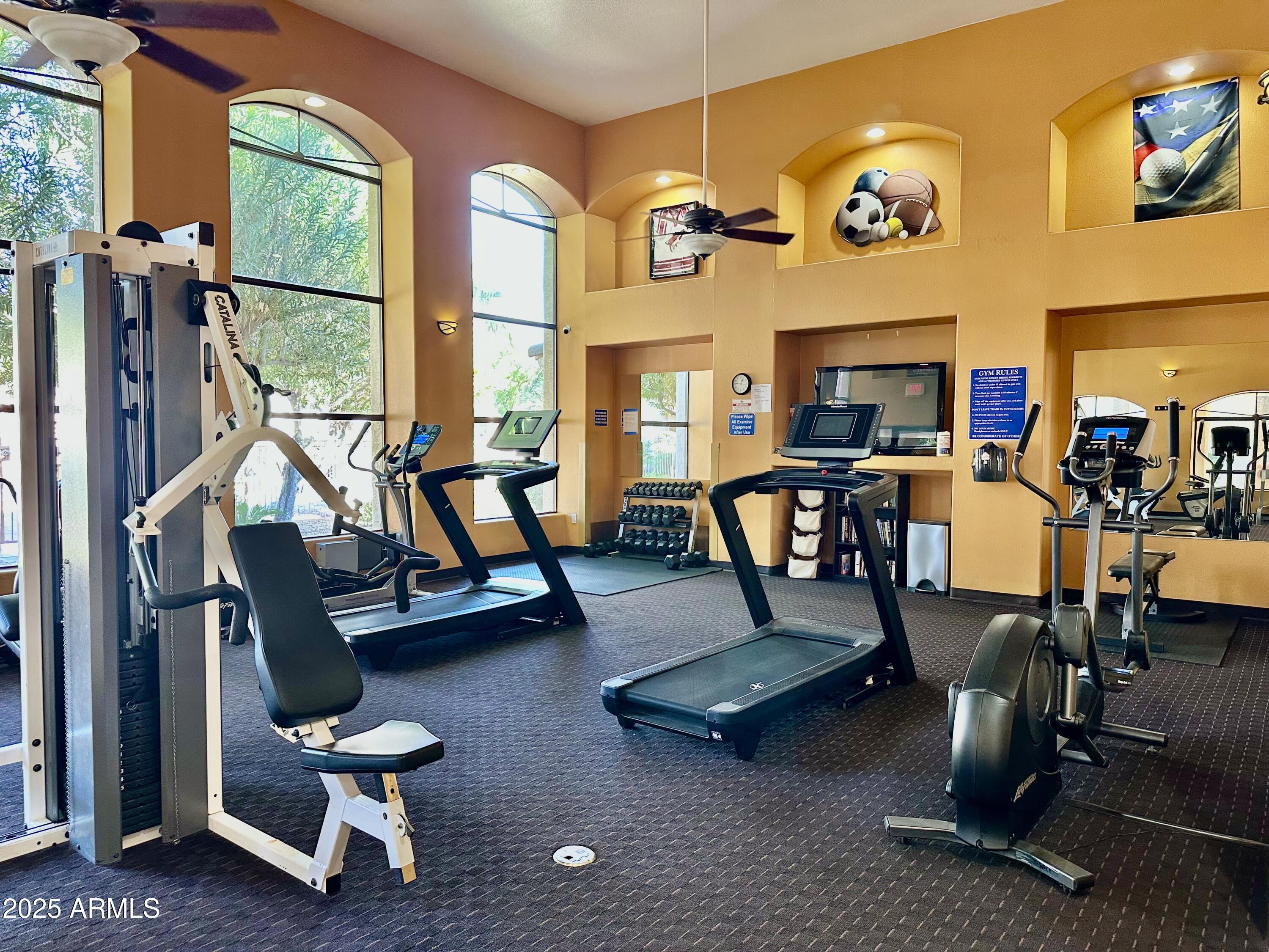 10030 West Indian School Road, Unit 227 Phoenix, AZ 85037 - Photo 6 of 22 a view of a room with gym equipment