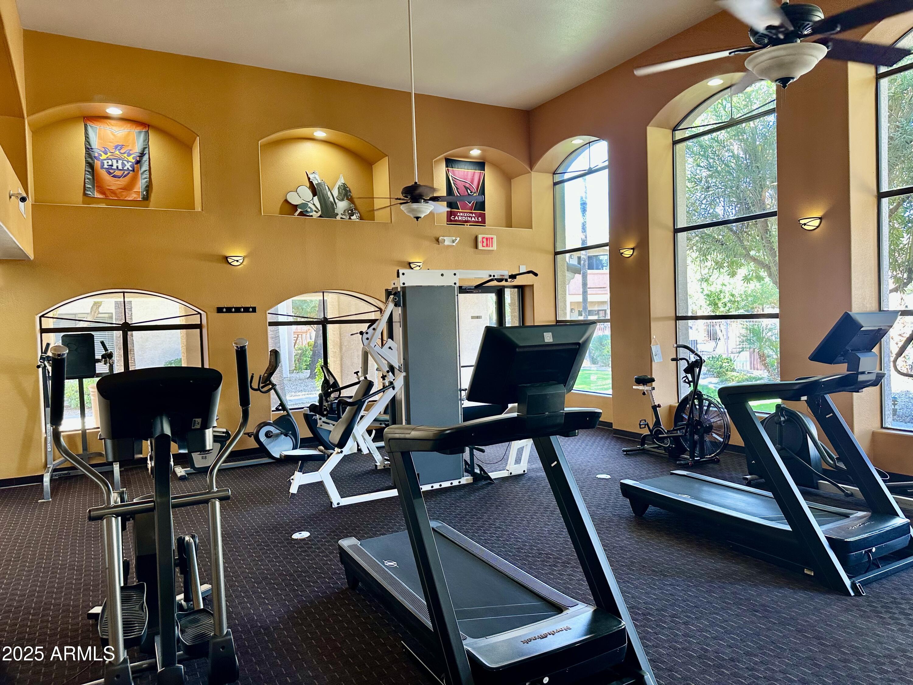 10030 West Indian School Road, Unit 227 Phoenix, AZ 85037 - Photo 7 of 22 a view of a workspace with furniture and a window