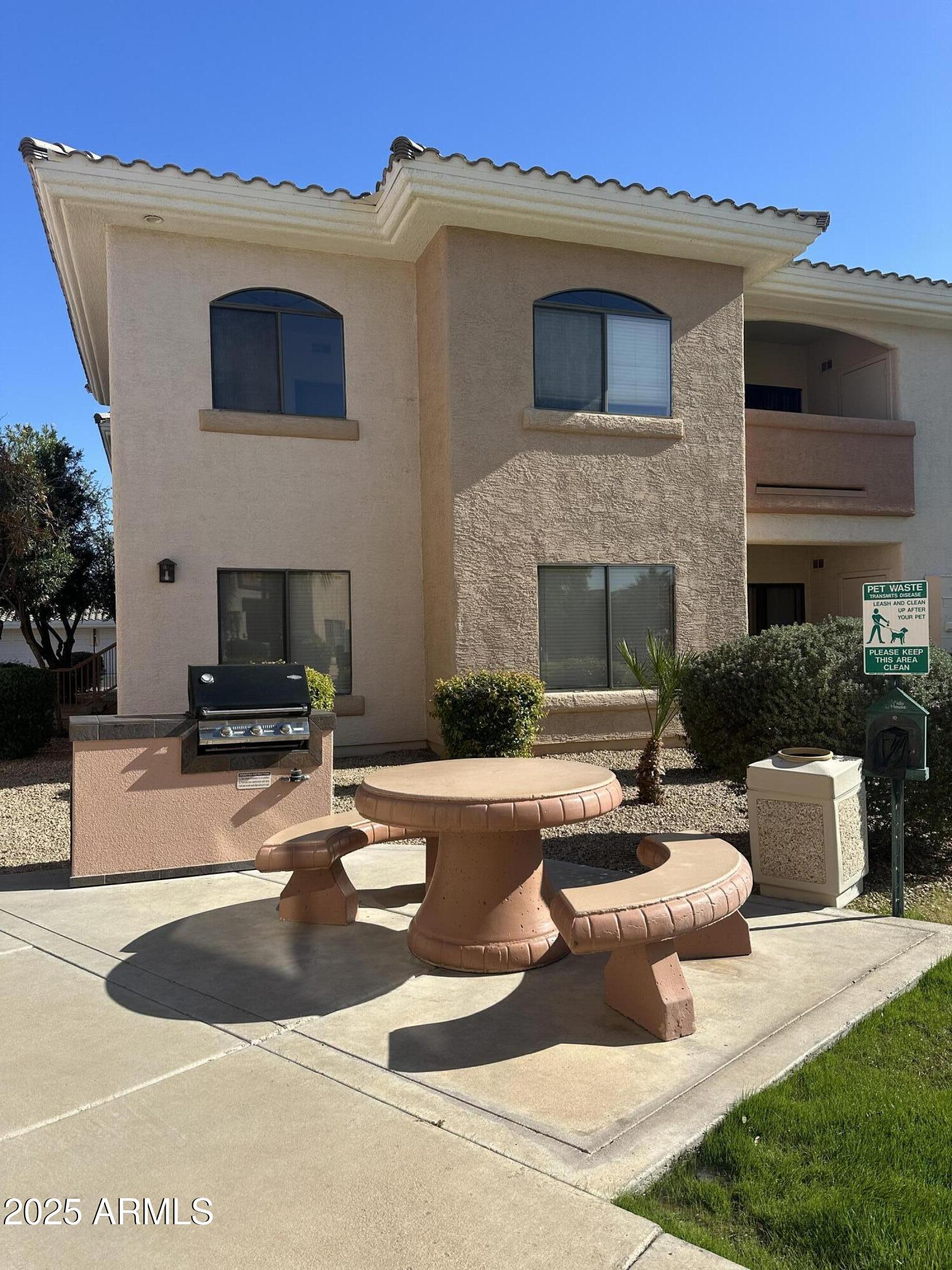 10030 West Indian School Road, Unit 227 Phoenix, AZ 85037 - Photo 8 of 22 a view of a house with swimming pool