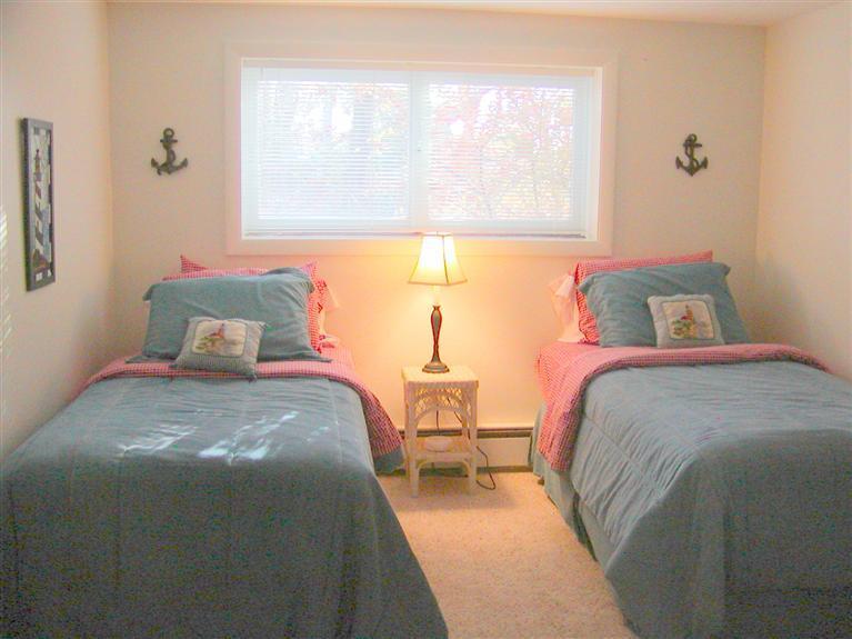 168 Holly Point Road Centerville, MA 02632 - Photo 28 of 28 a bedroom with a bed and a window
