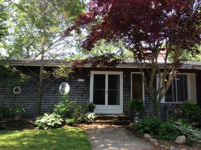 168 Holly Point Road Centerville, MA 02632 - Photo 4 of 28 a front view of house with a garden