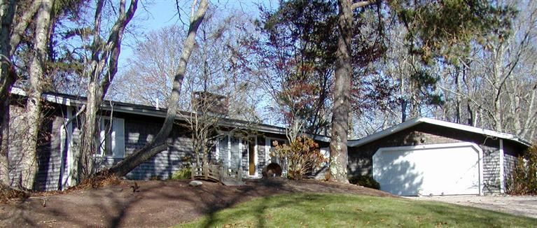 168 Holly Point Road Centerville, MA 02632 - Photo 8 of 28 a view of a house with a snow on the background