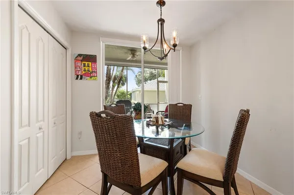 a dining room with furniture and window