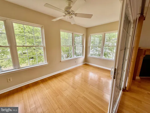 a kitchen with granite countertop stainless steel appliances a refrigerator stove microwave and cabinets