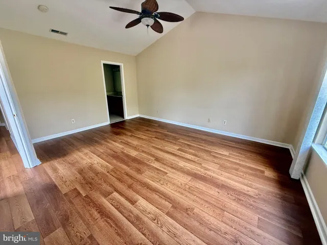 a bathroom with a double vanity sink a mirror and a shower