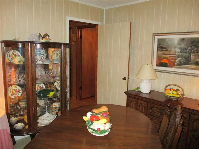 a living room with furniture a lamp and a fireplace