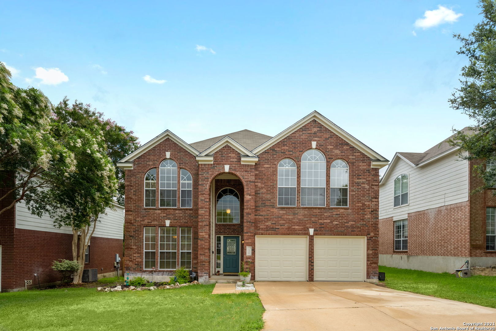 1326 Arrow Spring San Antonio, TX 78258 - Photo 1 of 1 a front view of a house with a yard and garage