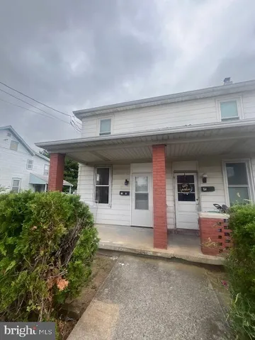 front view of house with a yard