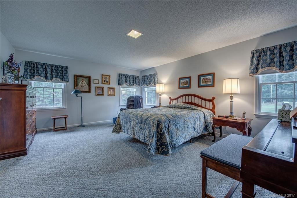 404 Loray Farm Road Dallas, NC 28034 - Photo 14 of 23 a bedroom with two beds and a couch