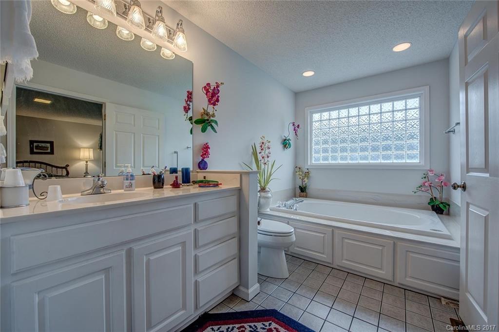 404 Loray Farm Road Dallas, NC 28034 - Photo 15 of 23 a bathroom with a sink a vanity and a mirror