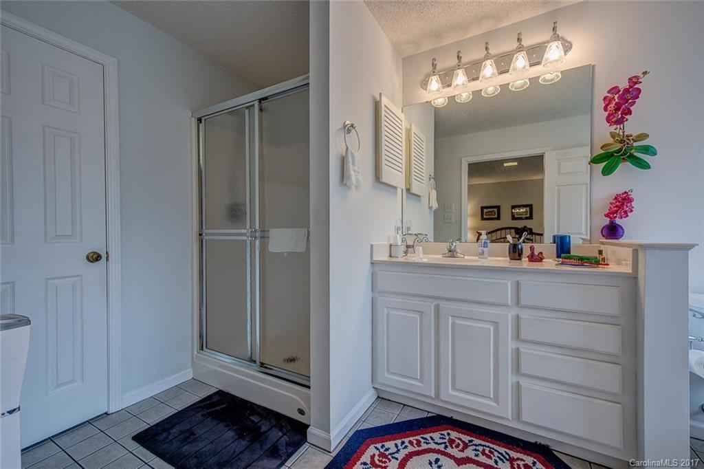 404 Loray Farm Road Dallas, NC 28034 - Photo 16 of 23 a bathroom with a sink a vanity and a mirror
