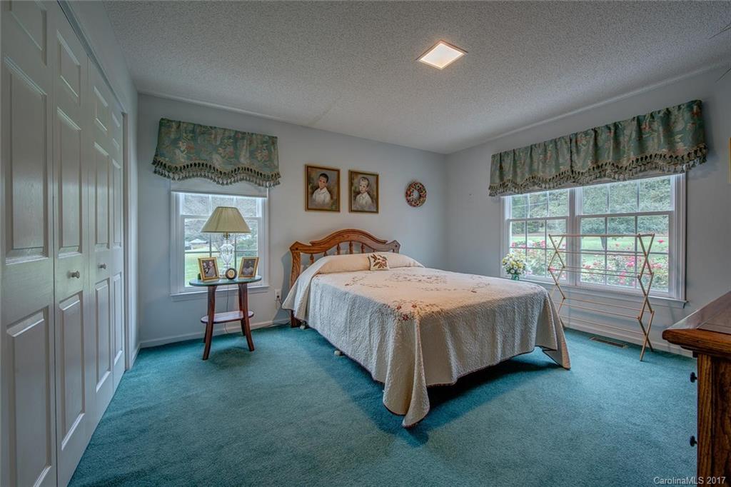 404 Loray Farm Road Dallas, NC 28034 - Photo 17 of 23 a spacious bedroom with a bed and a window