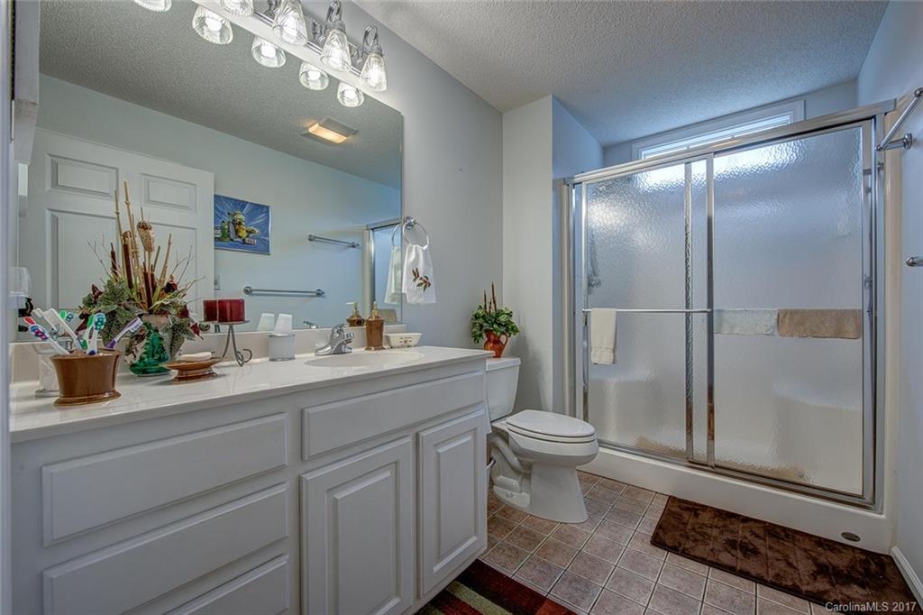 404 Loray Farm Road Dallas, NC 28034 - Photo 19 of 23 a bathroom with a sink a toilet and shower