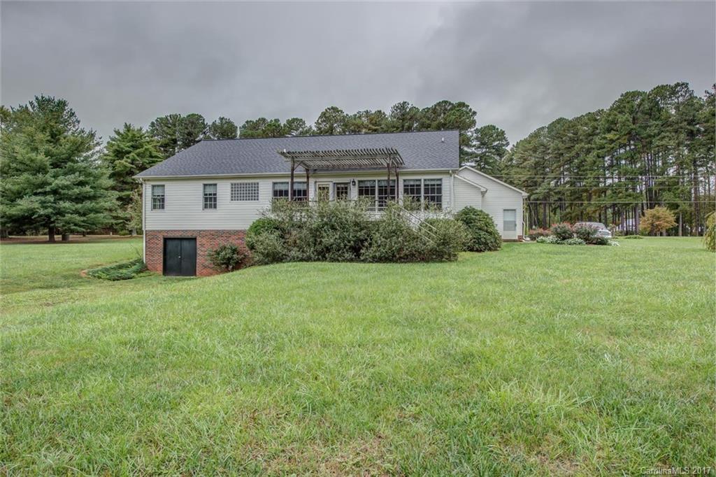404 Loray Farm Road Dallas, NC 28034 - Photo 22 of 23 a front view of a house with a yard