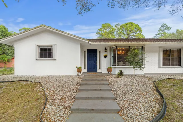 a front view of a house with a porch
