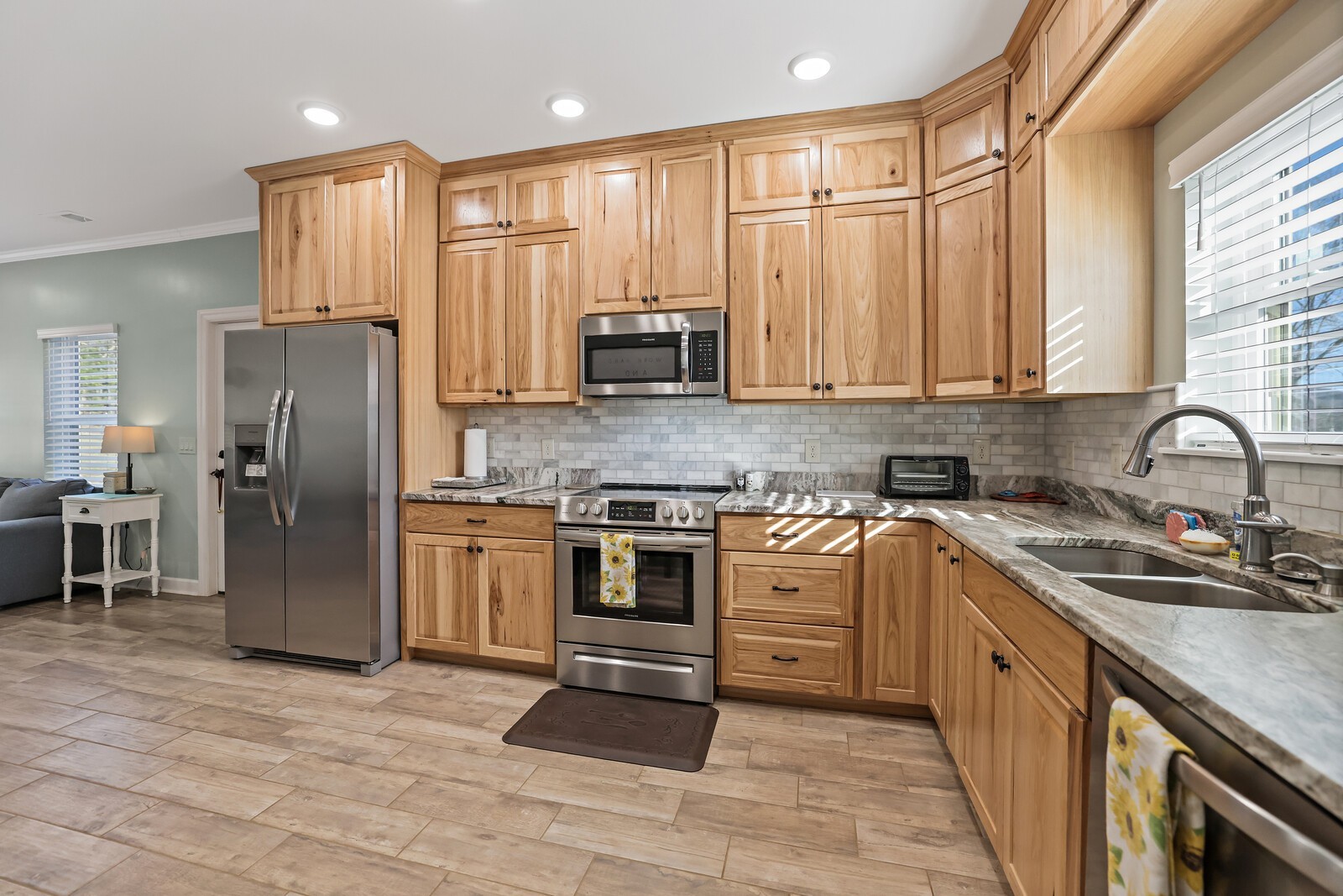 3755 Holmes Gap Road Watertown, TN 37184 - Photo 50 of 71 a kitchen with stainless steel appliances granite countertop a stove top oven a refrigerator and a sink