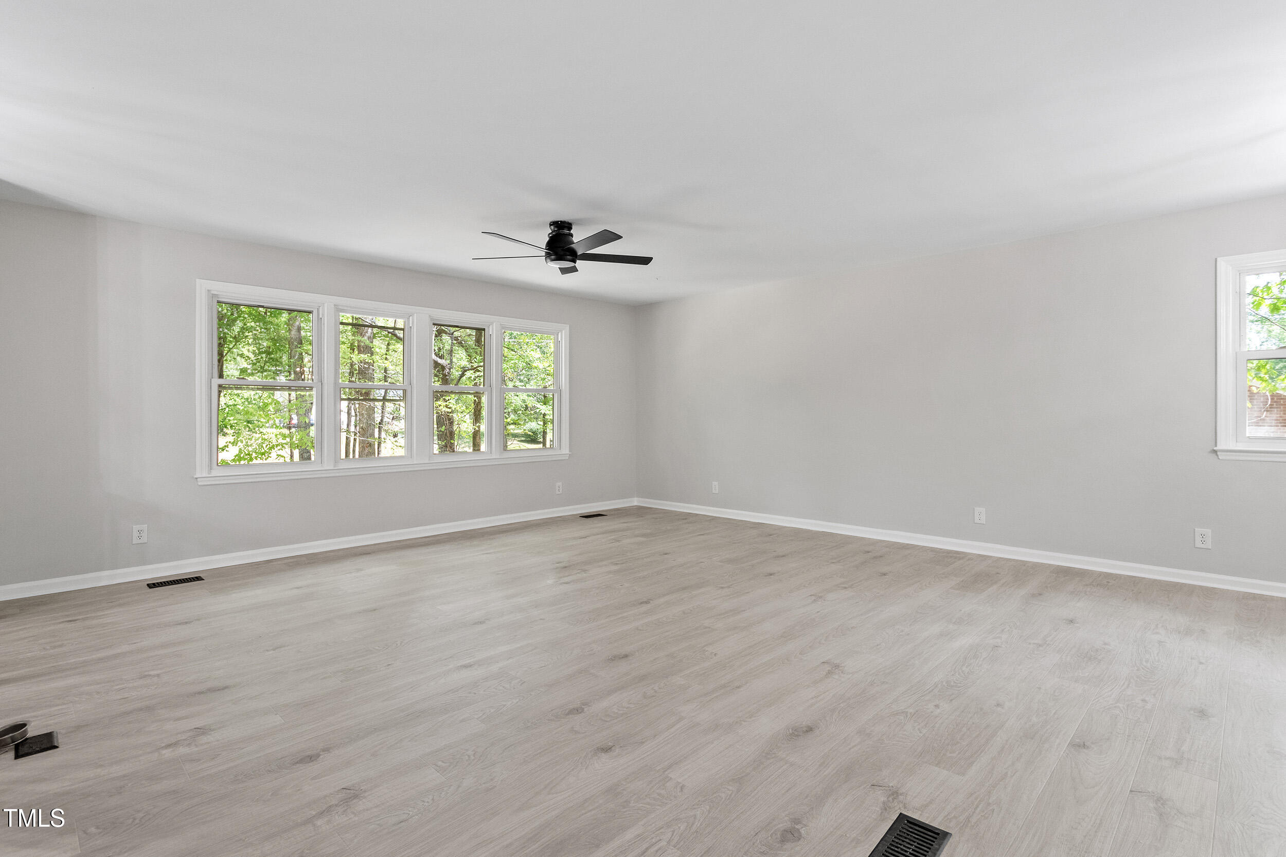 1514 Goodwin Road Durham, NC 27712 - Photo 16 of 33 wooden floor in an empty room with a window