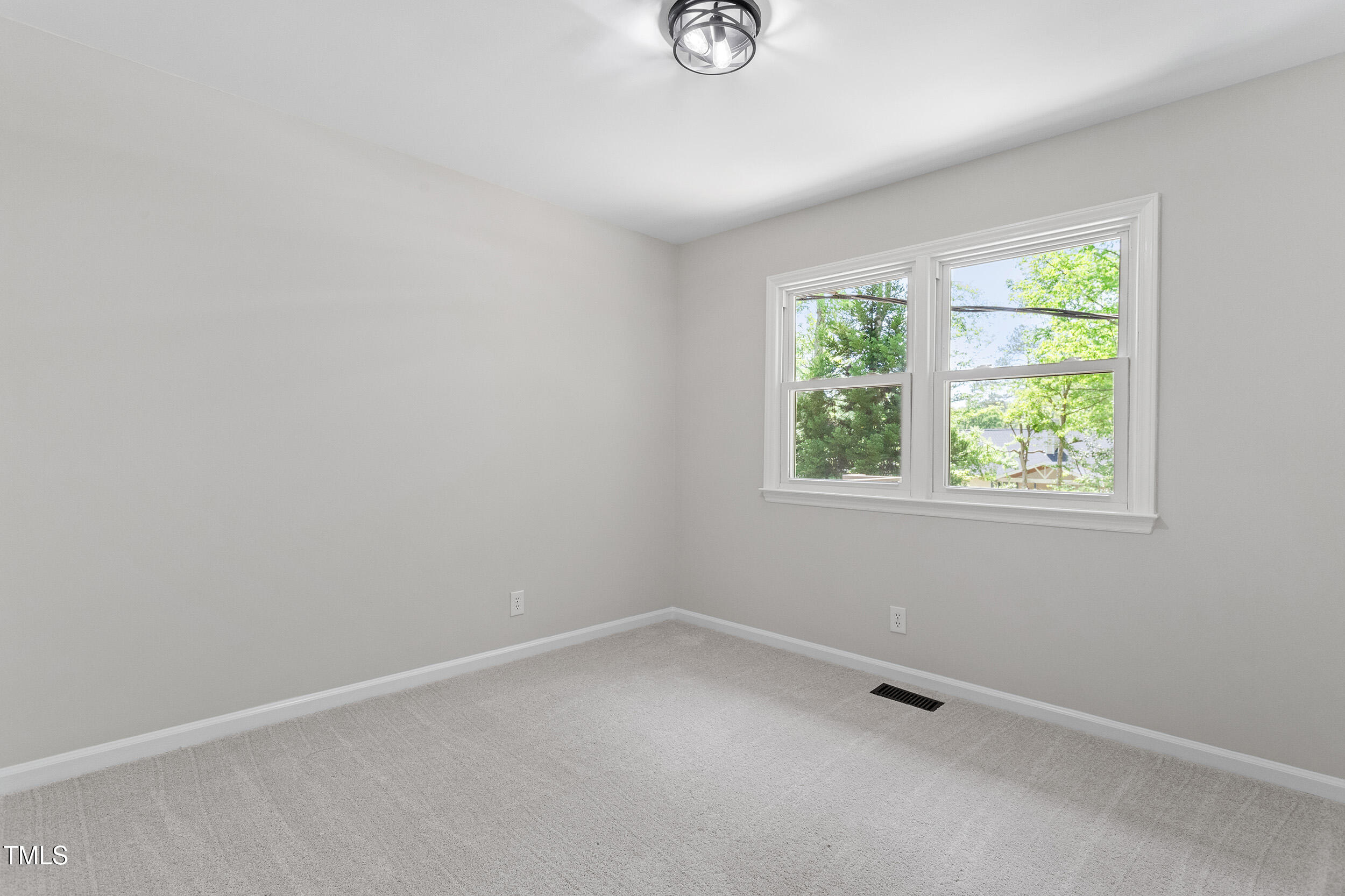 1514 Goodwin Road Durham, NC 27712 - Photo 20 of 33 an empty room with a window