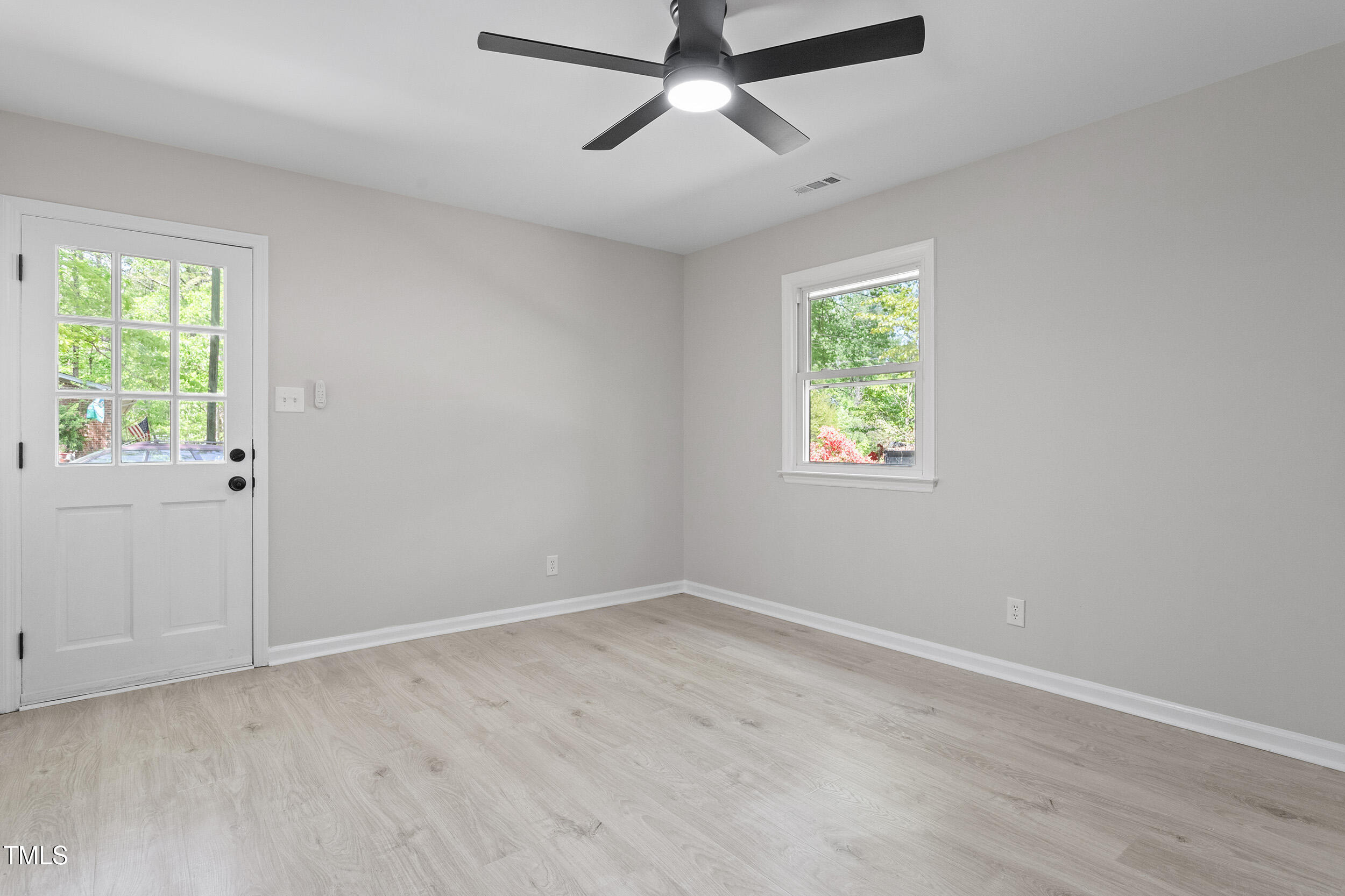 1514 Goodwin Road Durham, NC 27712 - Photo 21 of 33 a view of room with hardwood floor and window
