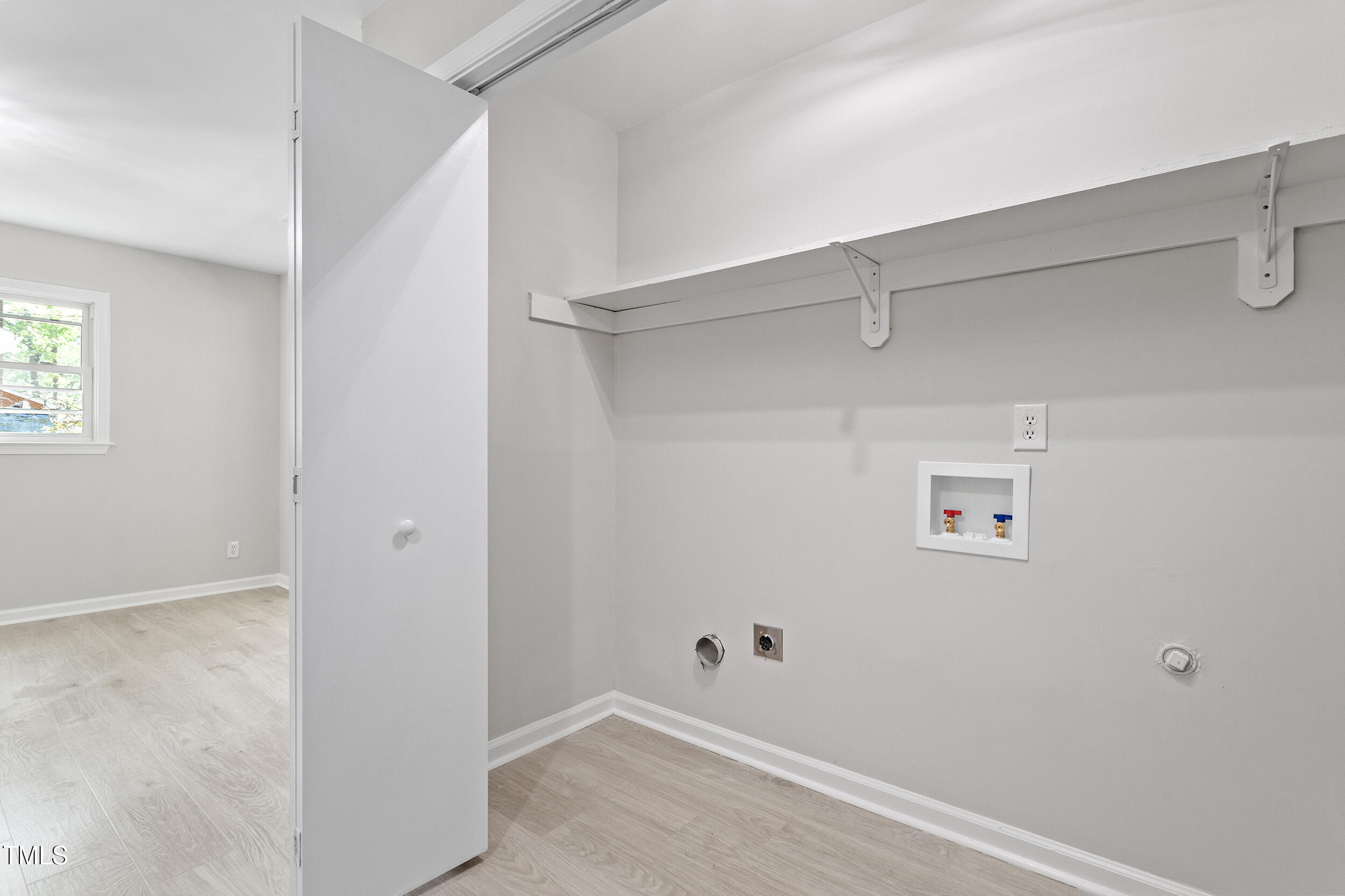 1514 Goodwin Road Durham, NC 27712 - Photo 25 of 33 a view of a room with racks on the wall