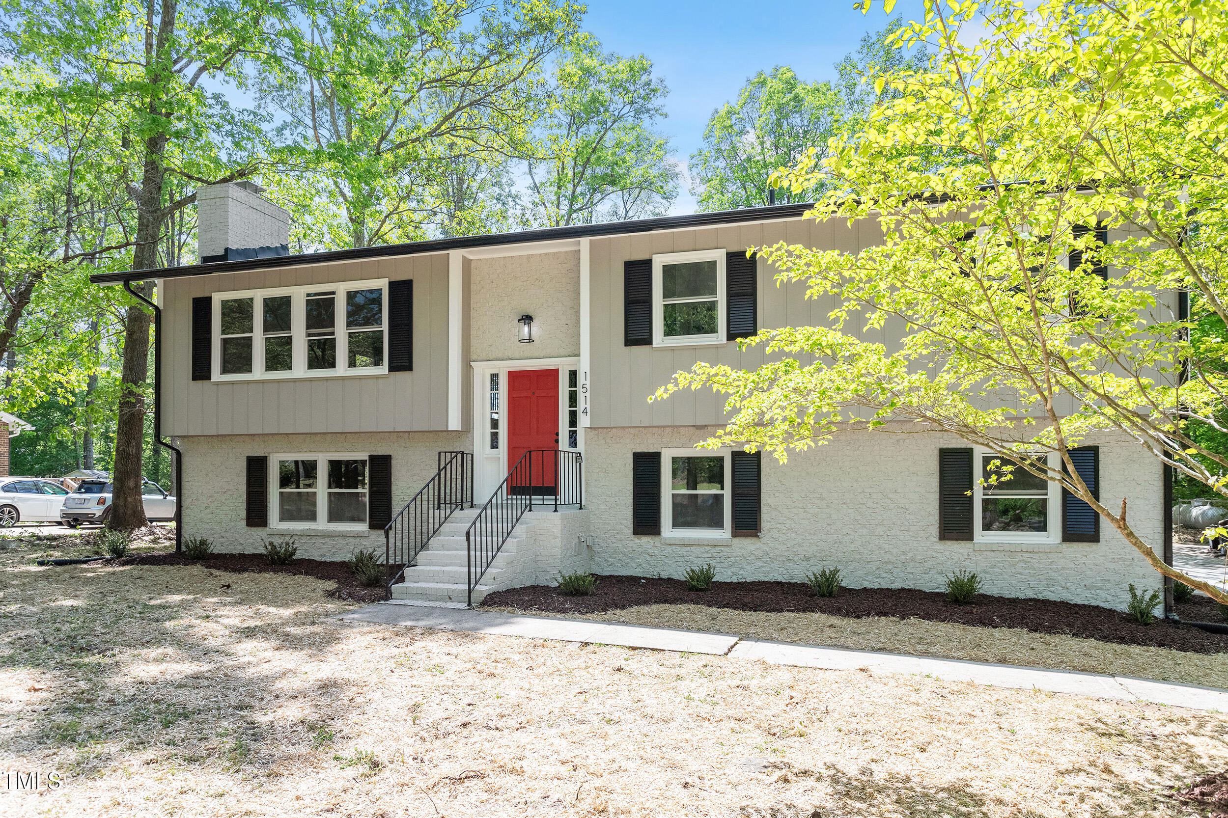 1514 Goodwin Road Durham, NC 27712 - Photo 26 of 33 a front view of a house with a yard and garage