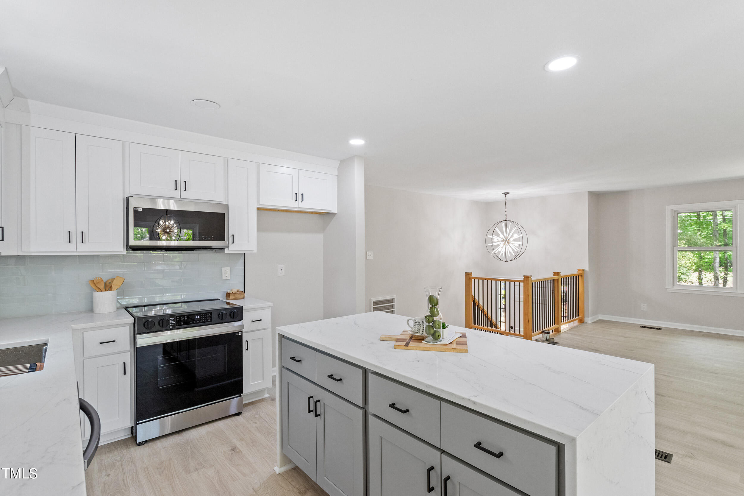 1514 Goodwin Road Durham, NC 27712 - Photo 2 of 33 a kitchen with granite countertop a stove and a sink