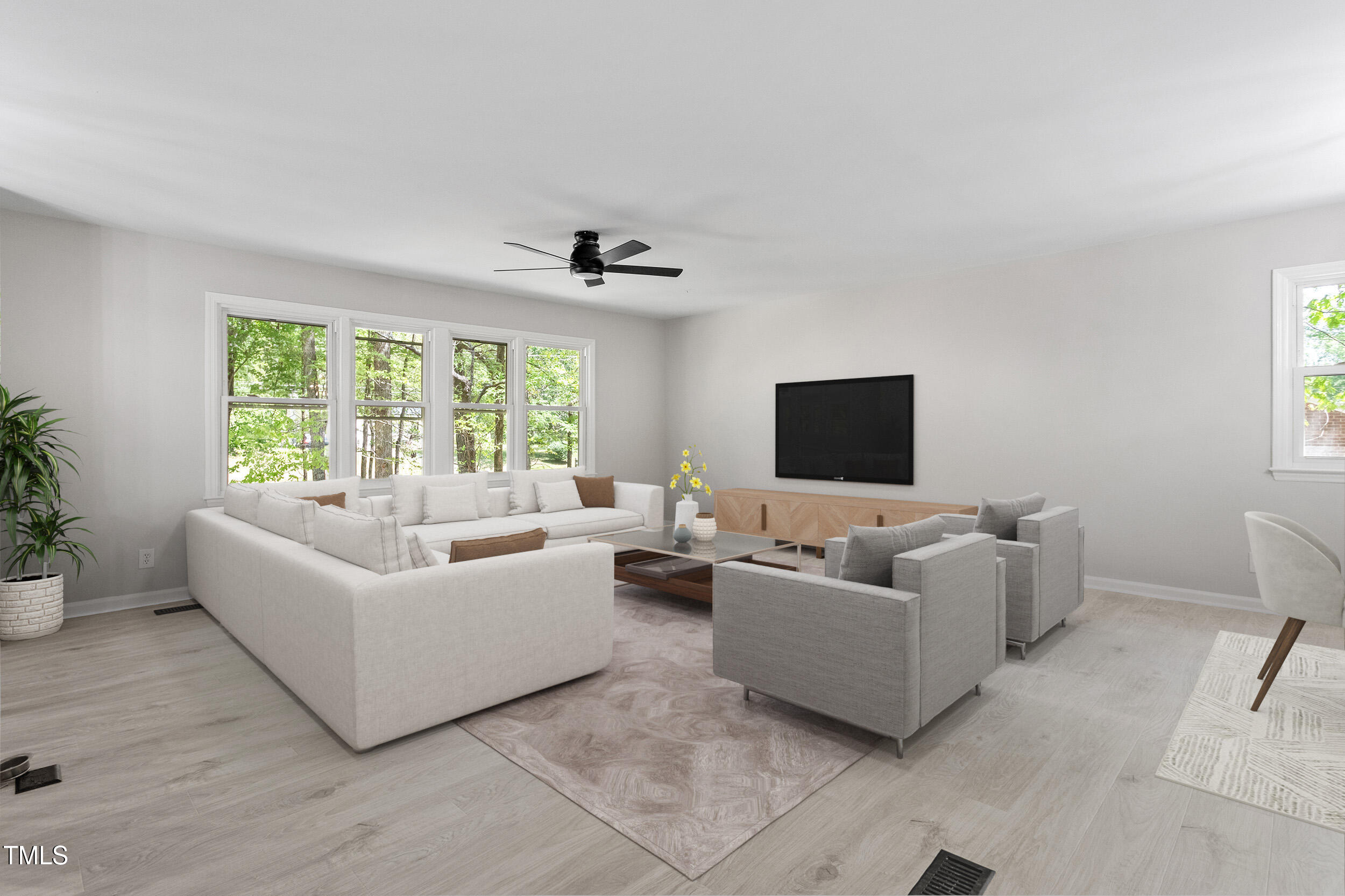 1514 Goodwin Road Durham, NC 27712 - Photo 4 of 33 a living room with furniture and a flat screen tv