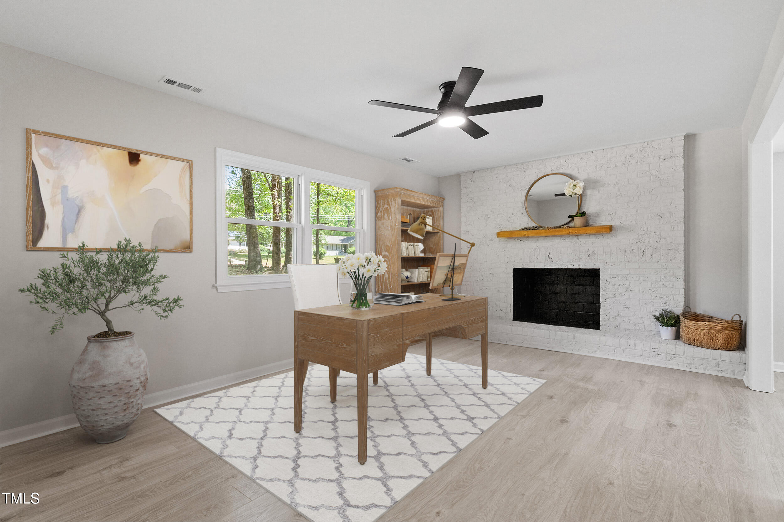 1514 Goodwin Road Durham, NC 27712 - Photo 7 of 33 a living room with furniture a fireplace and a potted plant