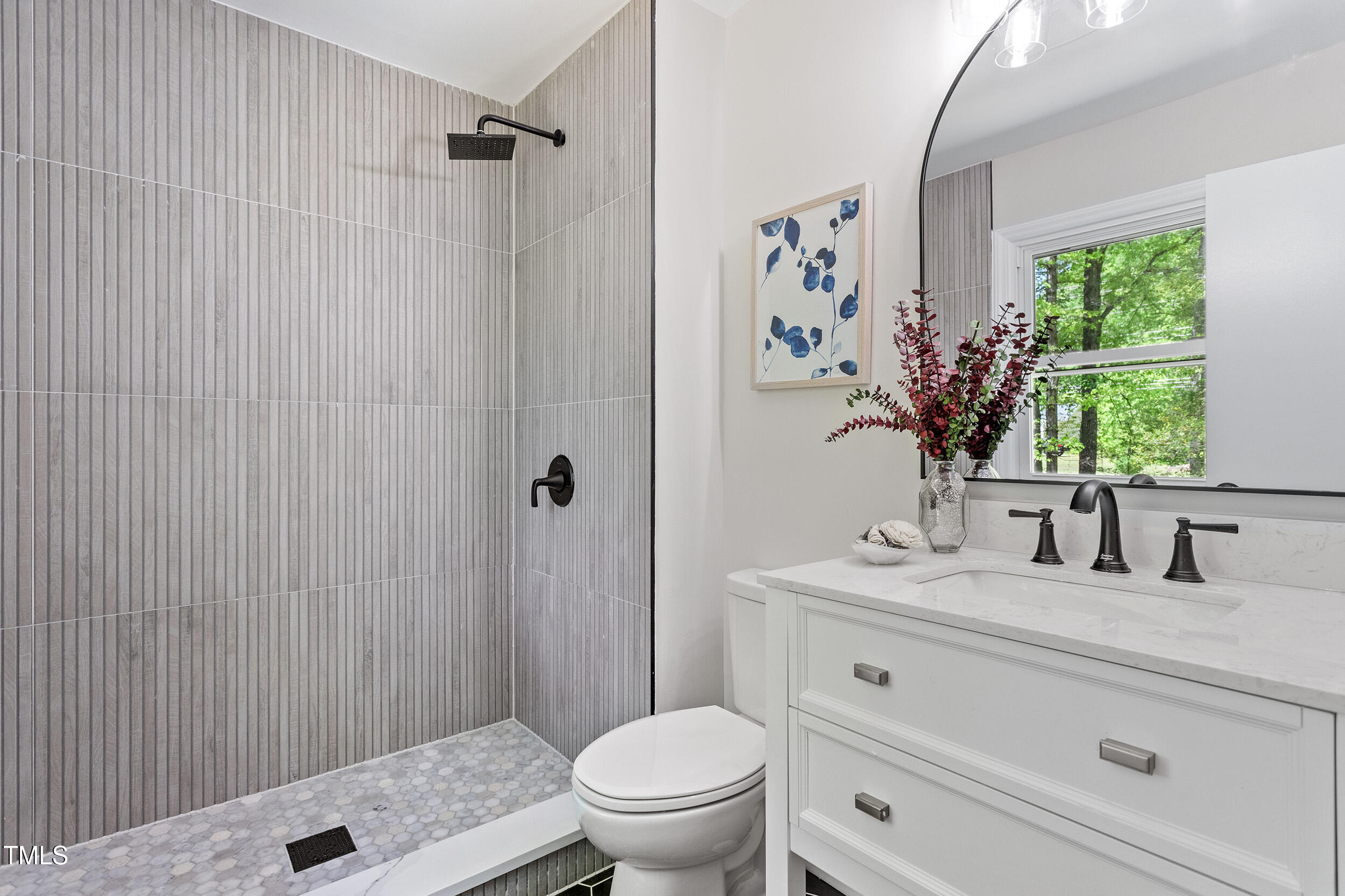 1514 Goodwin Road Durham, NC 27712 - Photo 9 of 33 a bathroom with a granite countertop sink a toilet and a mirror