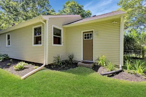 a backyard of a house with lots of green space
