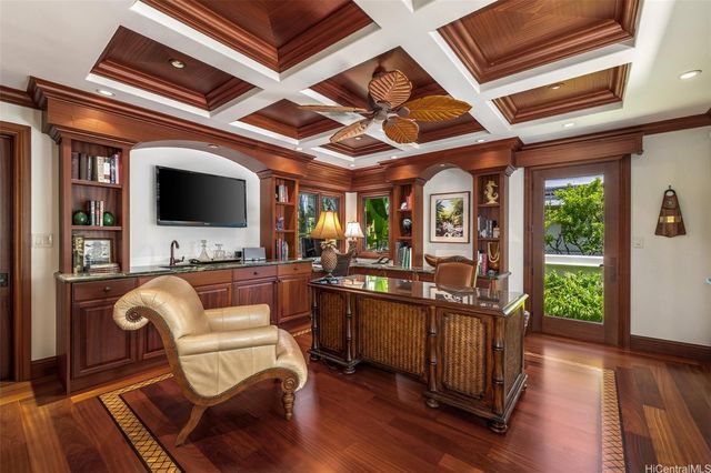 a view of living room kitchen with furniture and flat screen tv