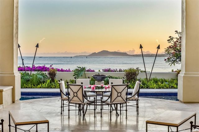 a view of a tables and chairs in patio