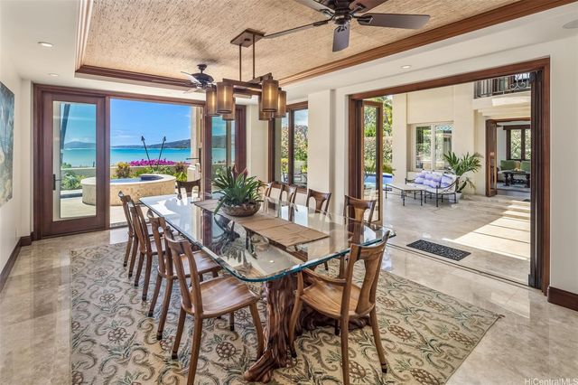 a view of a dining room with furniture window and outside view