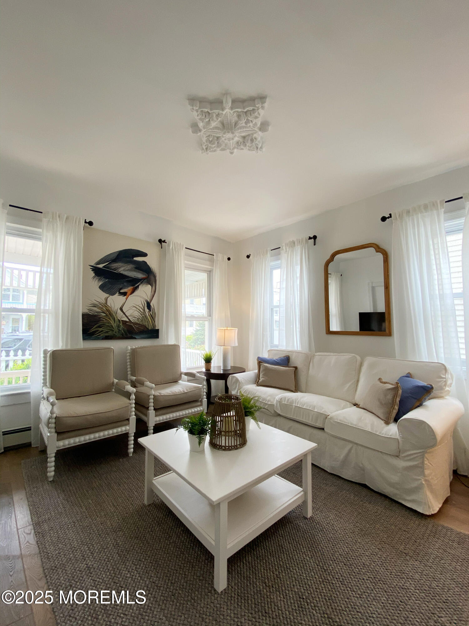22 Embury Avenue, Unit 1 Ocean Grove, NJ 07756 - Photo 3 of 14 a living room with furniture and a large window