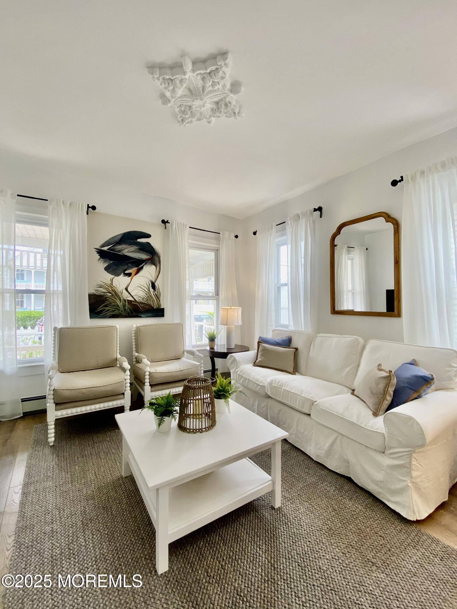 22 Embury Avenue, Unit 1 Ocean Grove, NJ 07756 - Photo 5 of 14 a living room with furniture and a rug
