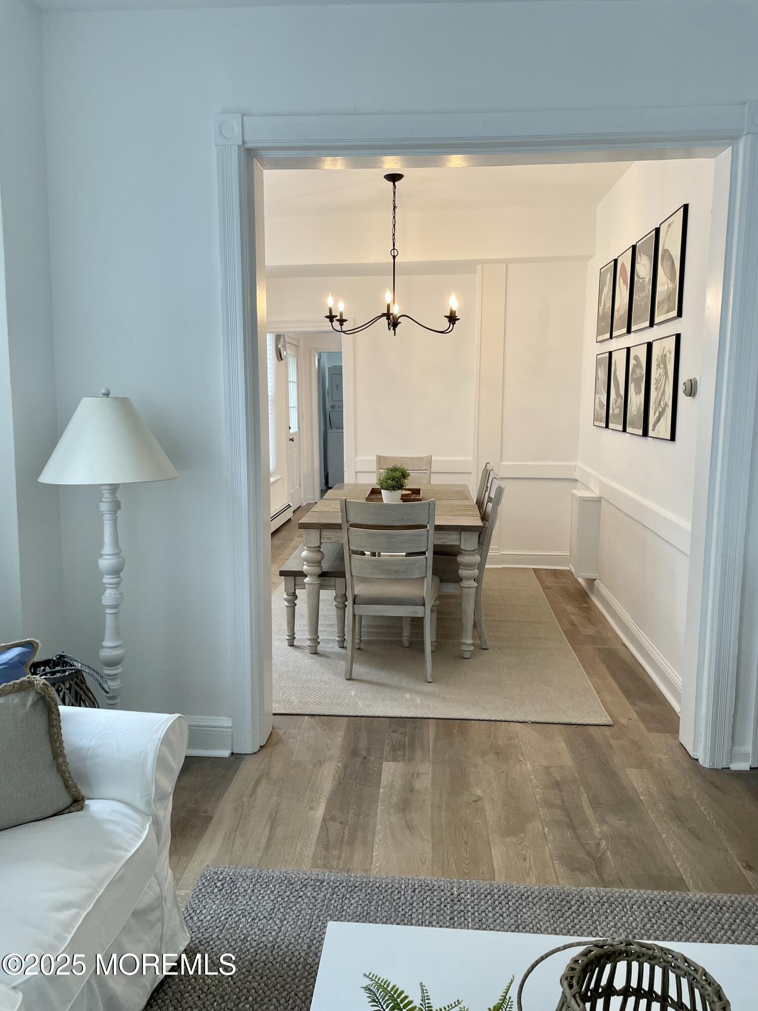 22 Embury Avenue, Unit 1 Ocean Grove, NJ 07756 - Photo 7 of 14 a living room with a couch and a table