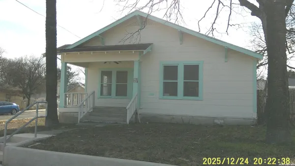 a front view of a house with a glass door