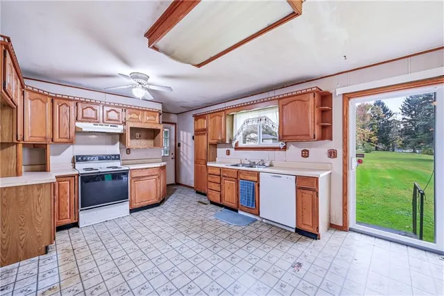 a kitchen with a refrigerator and a stove