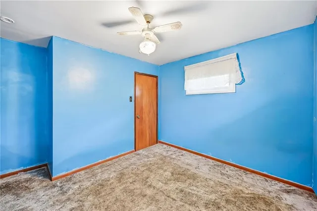 a bathroom with a shower a sink and a mirror