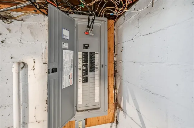 a water heater on the side of a window